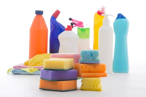 Plastic bottles of cleaning products and sponges isolated on whi — Stock Photo, Image
