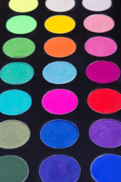 Make-up palette of colorfully eyeshadows over blac — Stock Photo, Image