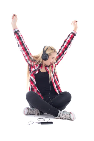 Happy teenage girl listening music in earphones isolated on whit — Stock Photo, Image