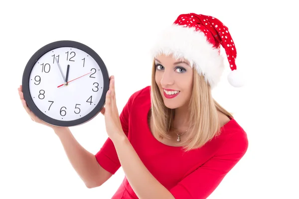 美丽的女人，在圣诞老人的帽子，在时钟摆姿势上白色孤立 — 图库照片