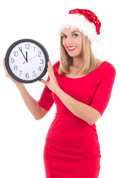 Genç kadın saati üzerinde beyaz izole poz ile Noel Baba şapkası — Stok fotoğraf