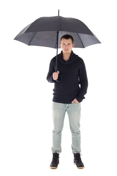 Young man in winter clothes posing with umbrella isolated on whi — Stock Photo, Image