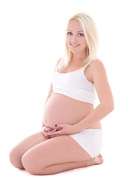 Unga vackra blondie gravid kvinna sitter isolerad på vit — Stockfoto