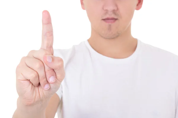 Close up of young man pointing upwards over white background — Stock Photo, Image