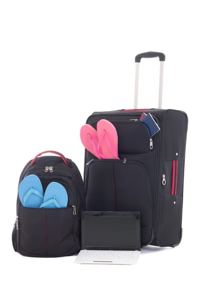 Ravel suitcase, backpack with clothing, laptop isolated on white — Stock Photo, Image