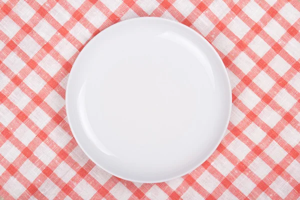 White empty plate over checkered background — Stock Photo, Image