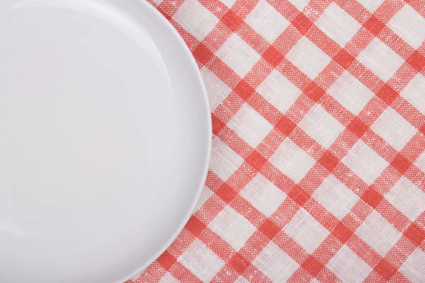 White empty plate over checkered background — Stock Photo, Image