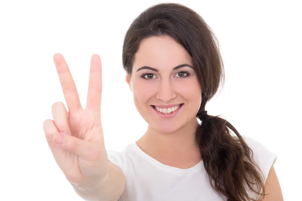 Mulher jovem feliz dando sinal de paz, isolado no branco — Fotografia de Stock