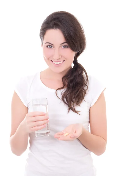 Junge, lächelnde Frau mit Pille und Glas Wasser isoliert auf whi — Stockfoto