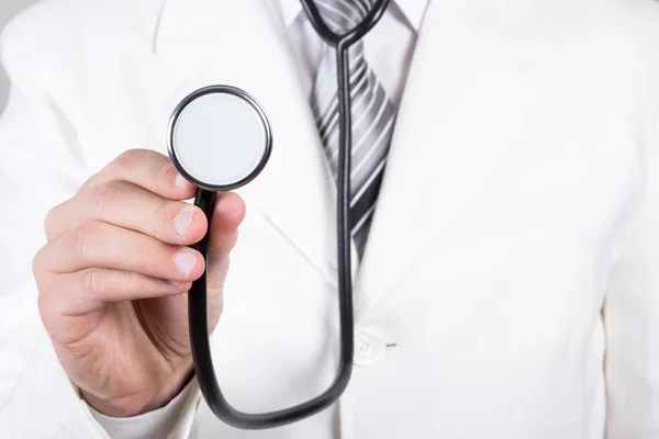 Close up of a doctors hand with stethoscope — Stock Photo, Image