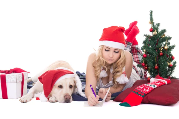 Teenage girl with dog in santa hat and christmas tree isolated o — Stock Photo, Image