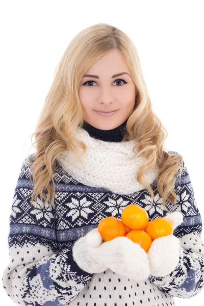 Beautiful girl in winter clothes with mandarins isolated on whit — Stock Photo, Image