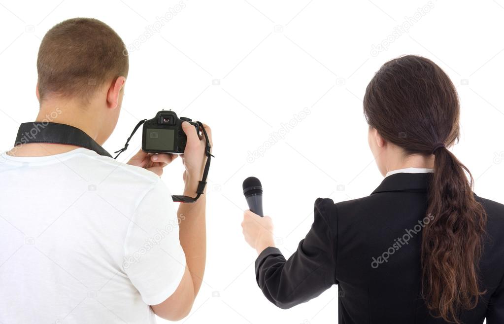 back view of woman with microphone and man with camera isolated