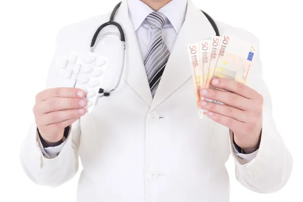 Package of pills and euro banknotes in male doctor's hands isola — Stock Photo, Image