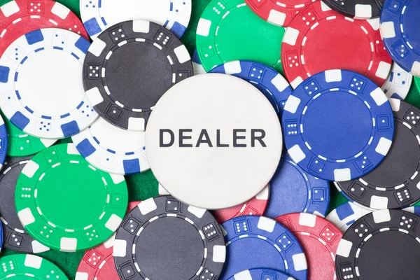 Close up of colorful poker chips and big dealer chip — Stock Photo, Image