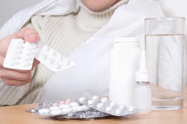 Close up of pills in male hand — Stock Photo, Image