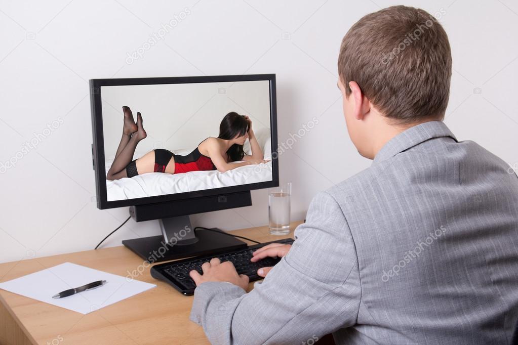 Businessman watching porn in computer at work Stock Photo by Â©Di-Studio  39574259