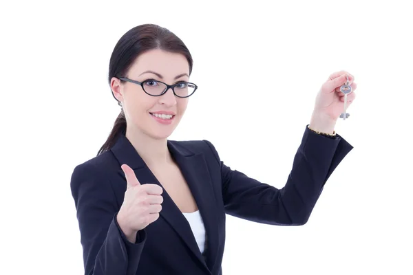 Young attractive business woman with key in hand thumbs up isola Royalty Free Stock Photos