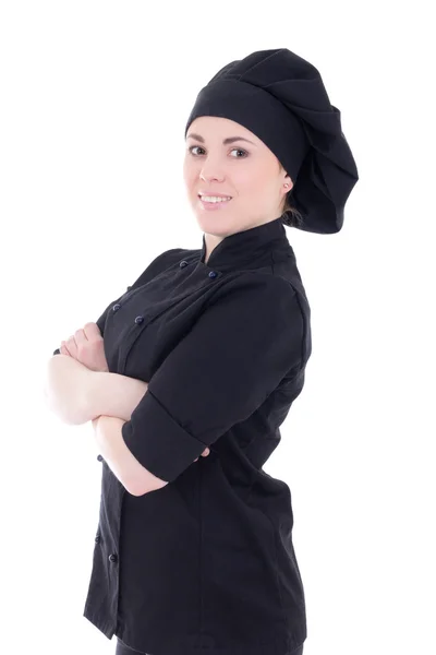 Joven atractivo cocina mujer en uniforme negro aislado en blanco —  Fotos de Stock