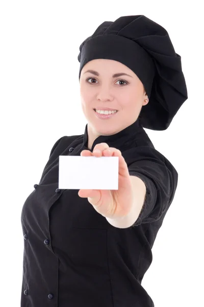 Mulher jovem cozinheiro em cartão de visita apresentando uniforme preto isolado — Fotografia de Stock