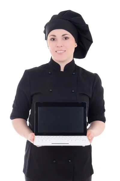Jeune cuisinier femme en montrant uniforme noir ordinateur portable avec copypaste — Photo