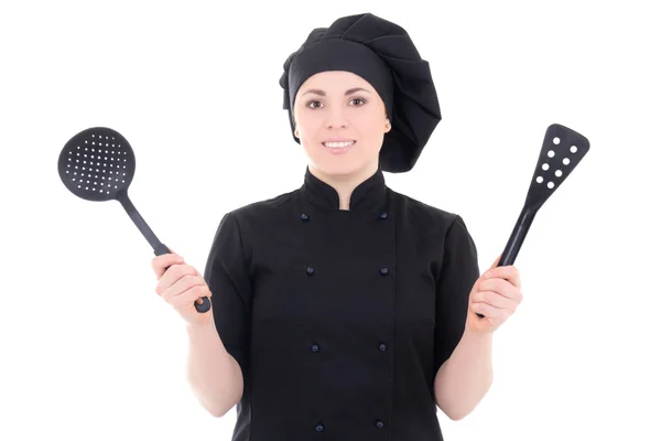 Retrato de mulher jovem cozinheiro em uniforme com utens plástico preto — Fotografia de Stock