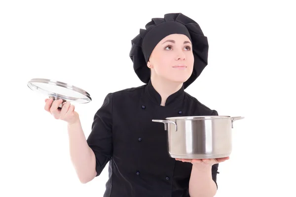 Portrait of young cook woman in black uniform holding pan isolat — Stock Photo, Image