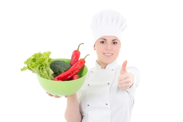 Attraente giovane cuoco donna in uniforme con i pollici di verdure — Foto Stock