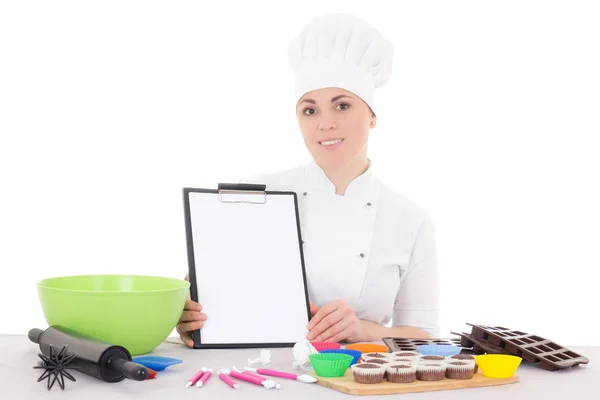 Attractive female confectioner in cook uniform sitting at the ki — Stock Photo, Image