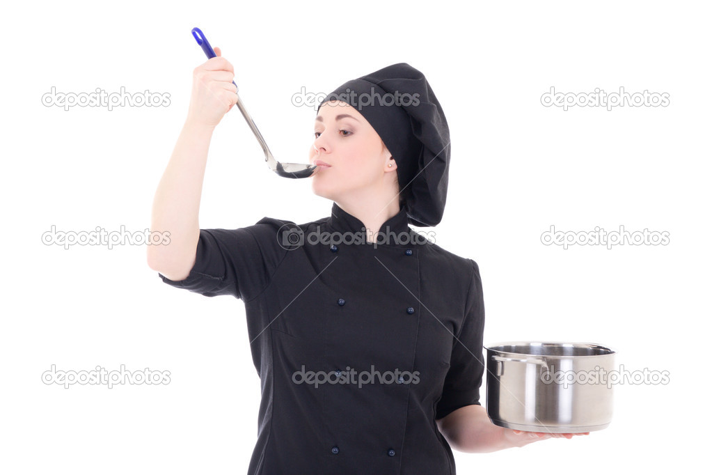 portrait of young cook woman in black uniform holding pan and ta