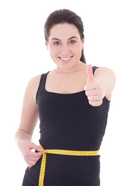 Desportiva mulher medir sua cintura e polegares para cima isolado no branco — Fotografia de Stock