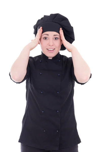 Mujer emocionada cocinero en uniforme negro aislado en blanco —  Fotos de Stock