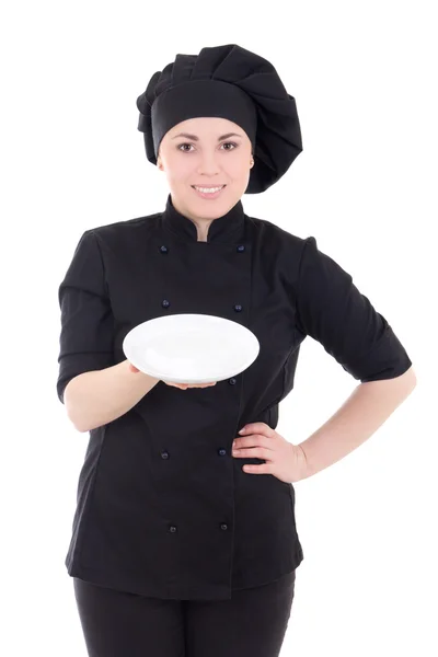 Retrato de mulher jovem cozinheiro em preto uniforme com prato vazio eu — Fotografia de Stock
