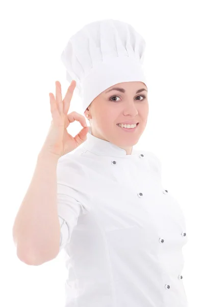 Mujer joven cocinero en uniforme mostrando signo bien aislado en blanco —  Fotos de Stock