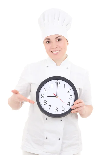 Retrato de mujer joven cocinero en uniforme mostrando reloj aislado o —  Fotos de Stock