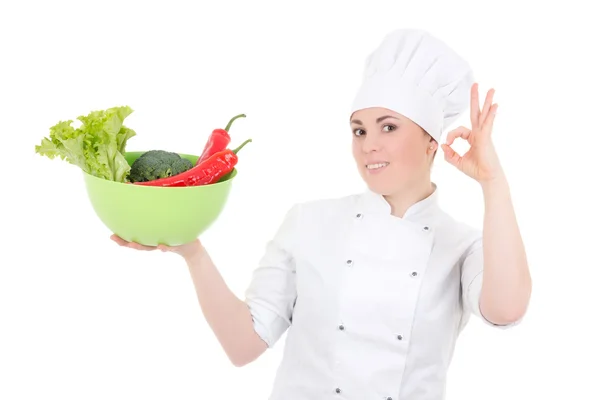 Mujer joven cocinero atractivo uniforme con verduras o mostrando —  Fotos de Stock