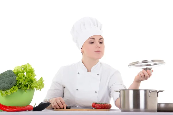 Mujer joven cocinero atractivo en cocción uniforme aislado en blanco —  Fotos de Stock