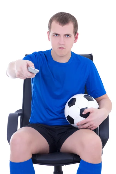 リモート制御を見て白で隔離されるフットボールの試合を持つ男 — ストック写真