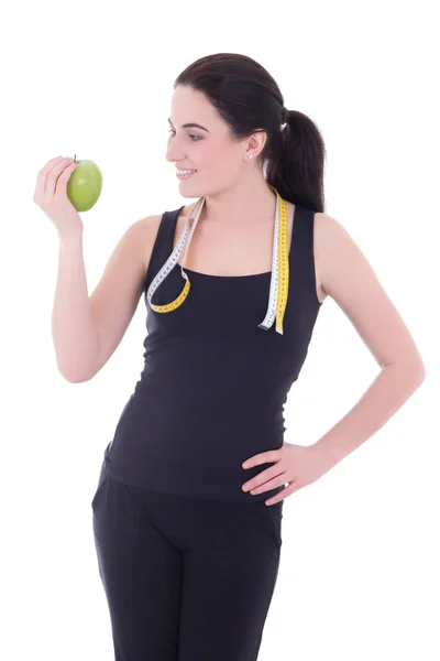 Unga attraktiva sportiga kvinnan med äpple och mäta tejp isol — Stockfoto