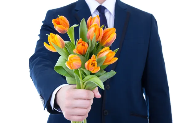 Schöne orange Tulpen in männlicher Hand isoliert auf weiss — Stockfoto