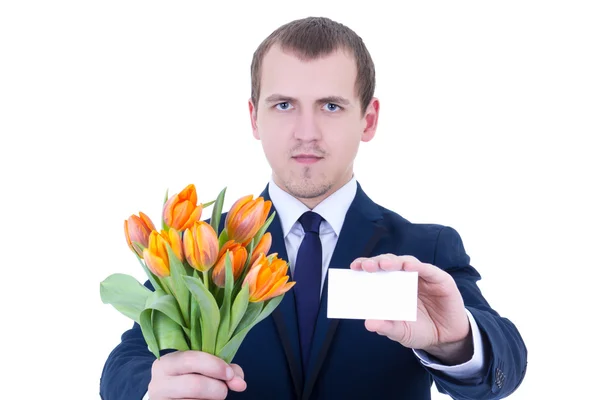 Livraison - jeune homme en costume d'affaires détenant des tulipes de fleurs et — Photo