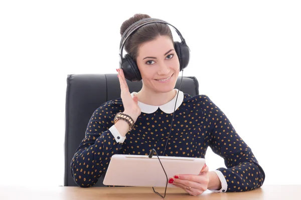 Young beautiful woman sitting in office and listening music on t Royalty Free Stock Images