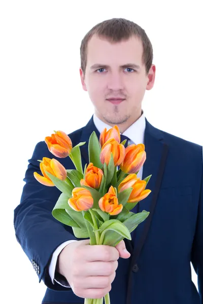 Jeune homme donnant des tas de tulipes isolé sur blanc - focus sur f — Photo