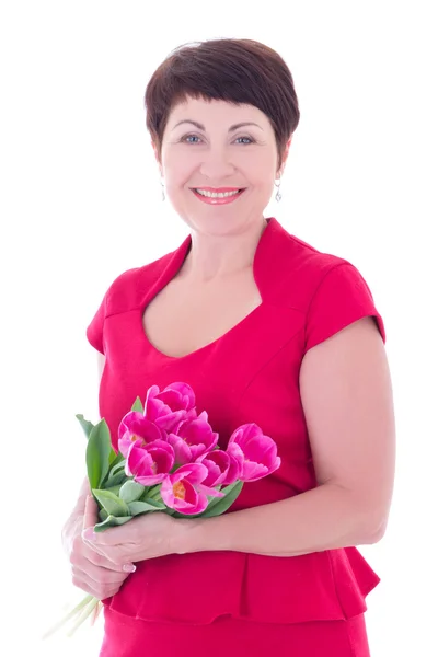 Happy middle aged woman with flowers isolated on white — Stock Photo, Image