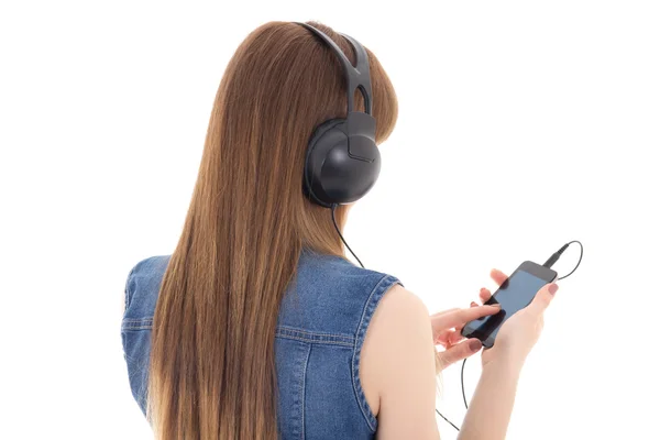 Mladá žena poslech hudby s mobilním telefonem, izolované na bílém — Stock fotografie