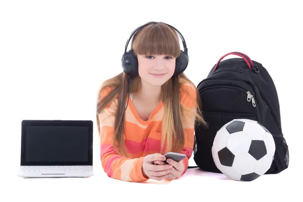 Dospívající dívka v sluchátka s notebookem a telefon izolovaných na whi — Stock fotografie