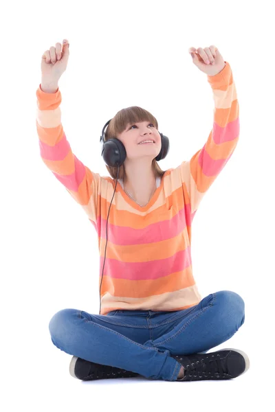 Happy beautiful teenage girl listening music in headphones — Stock Photo, Image