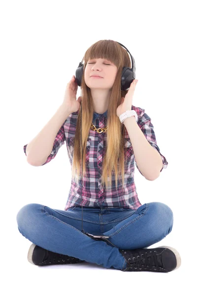 Cute dreaming teenage girl sitting and listening music with head — Stock Photo, Image