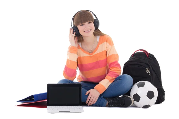 Teenage girl in headphones sitting with laptop — Stock Photo, Image