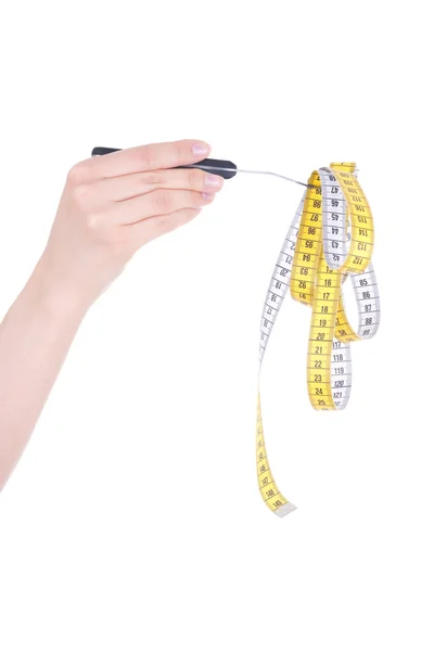 Woman hand with fork and measure tape isolated on white backgrou — Stock Photo, Image